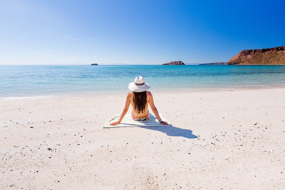 Baja beach woman sunbathing