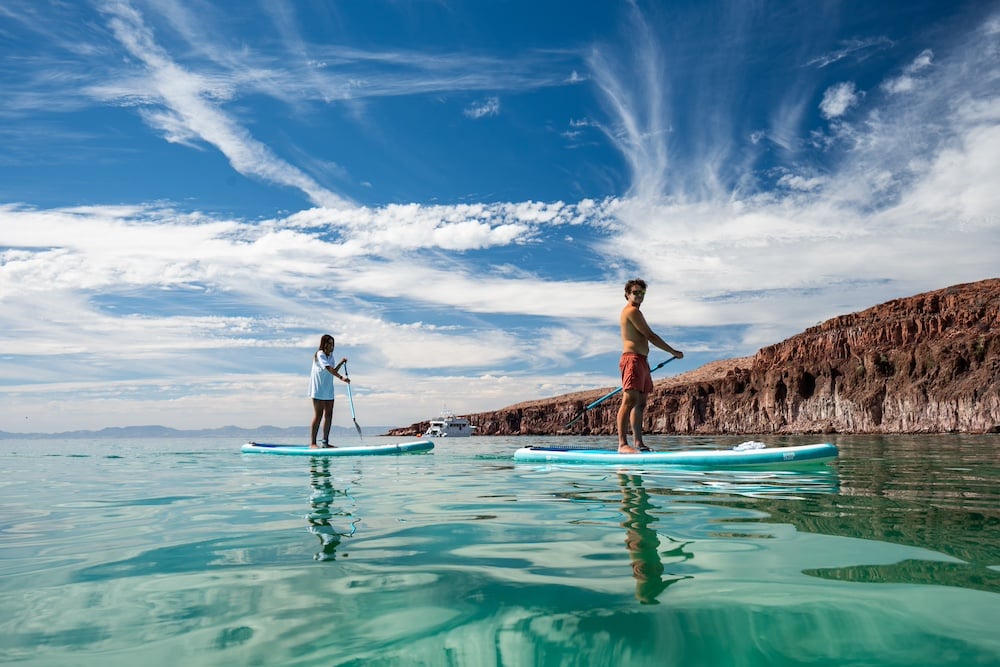 Couple paddleboarding in the Sea of Cortex